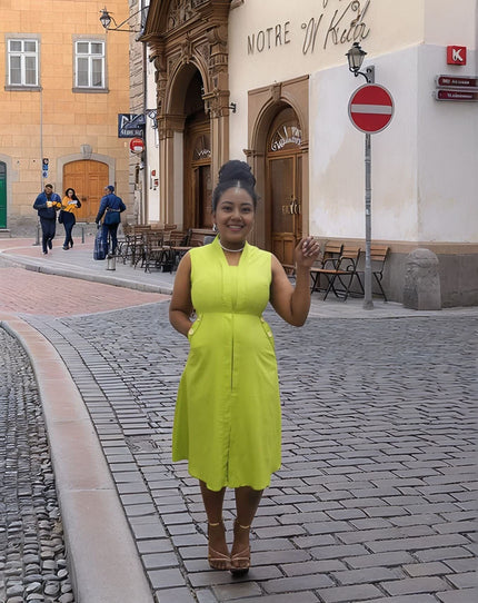 Sleeveless midi utility dress, bright lime green with front seams and pockets