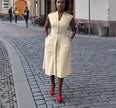 Sleeveless midi utility dress, light cream with front seams and pockets