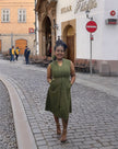 Sleeveless midi utility dress, olive green with front seams and pockets