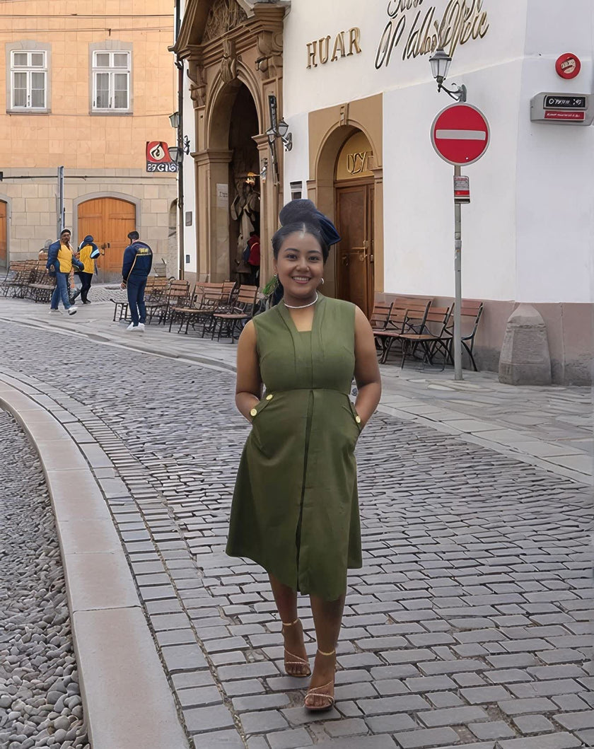 Sleeveless midi utility dress, olive green with front seams and pockets