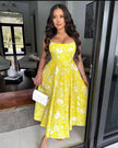 Yellow floral midi dress with sweetheart neckline, spaghetti straps, gathered skirt