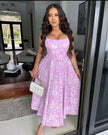 Purple floral midi dress with sweetheart neckline, spaghetti straps, gathered skirt