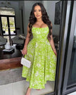 Green floral midi dress with sweetheart neckline, spaghetti straps, gathered skirt