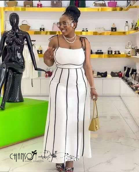 White striped midi dress with spaghetti straps, fitted bodice, long skirt