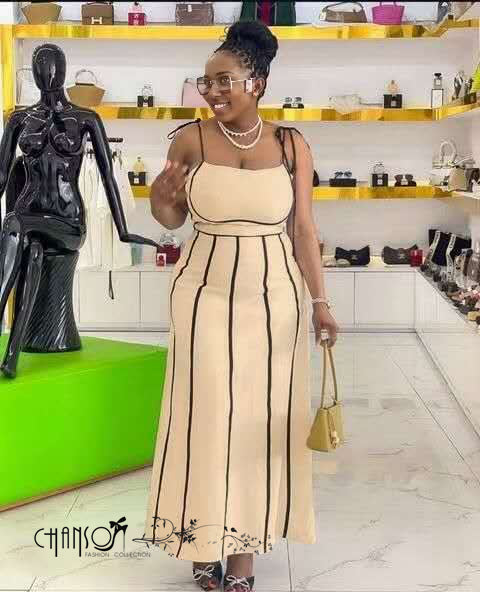 Tan striped midi dress with spaghetti straps, fitted bodice, long skirt