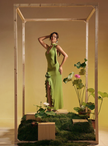 Green halter maxi dress with rose appliques and flowing ruffle hem
