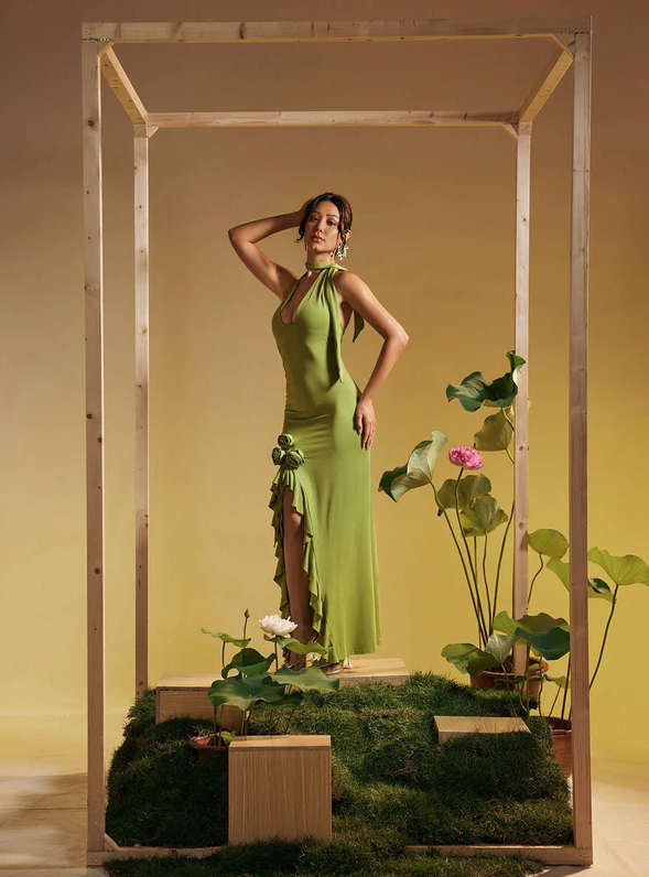 Green halter maxi dress with rose appliques and flowing ruffle hem
