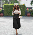 Pleated A-line midi skirt with stretch waistband and front drape panel in black