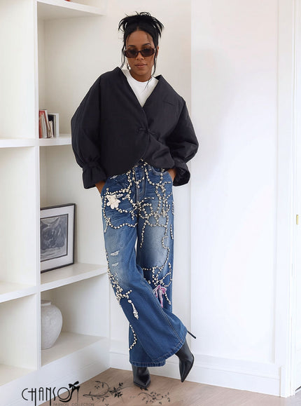 Blue wide-leg jeans with rhinestone chains and ribbon-style print, relaxed fit