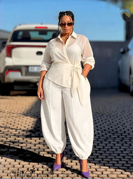 Cream wrap-front collared long-sleeve shirt with waist tie and button placket