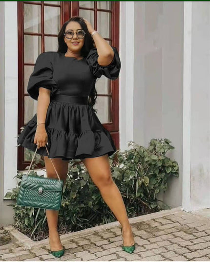 Black puff-sleeve mini dress with ruffle hem and elasticated waist