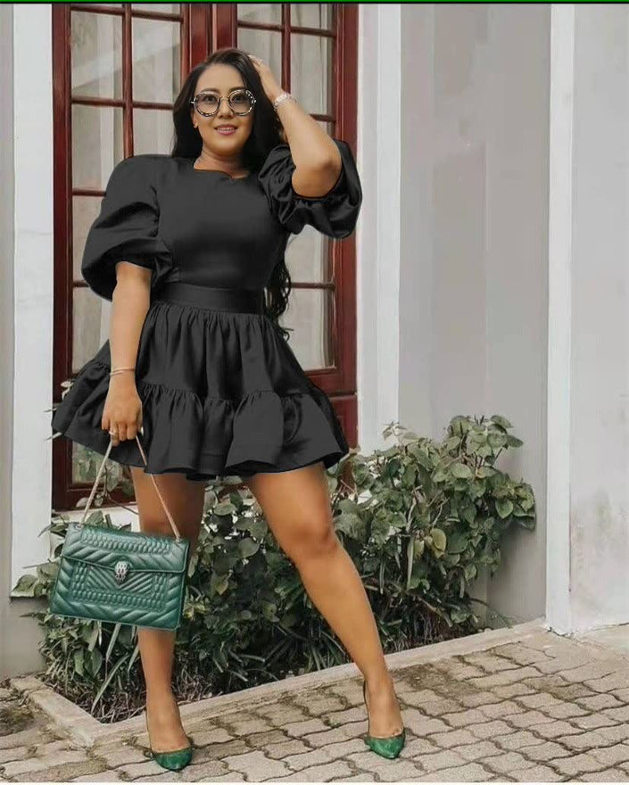 Black puff-sleeve mini dress with ruffle hem and elasticated waist