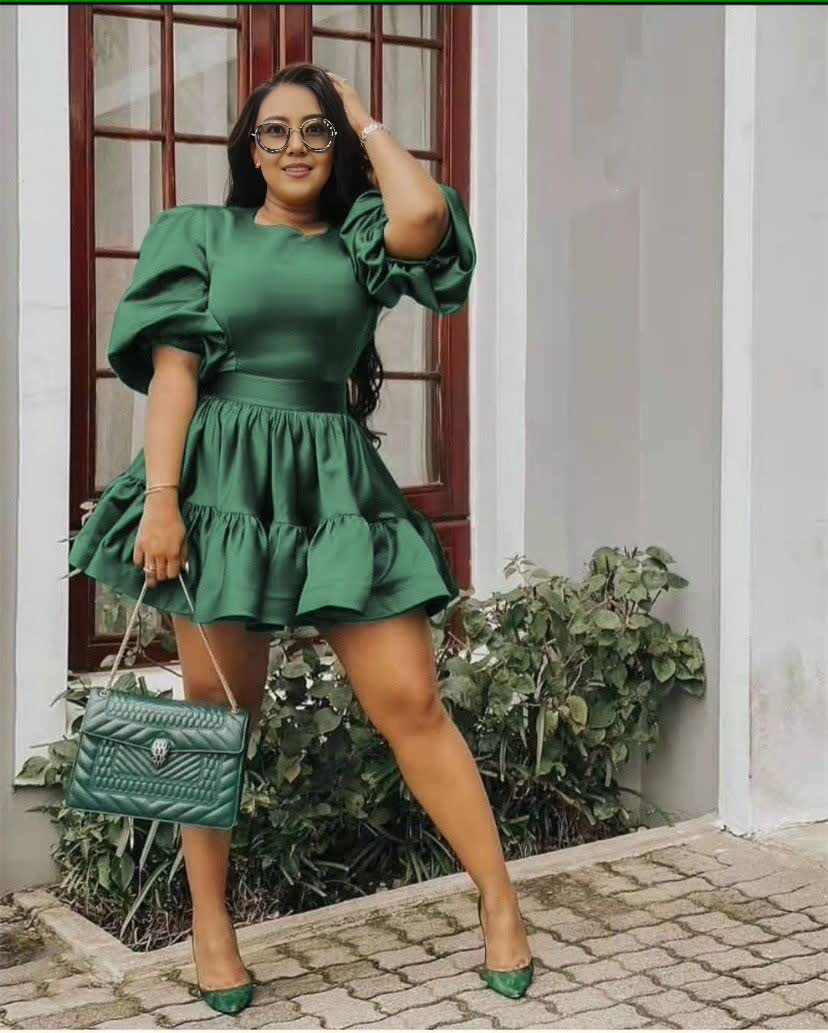 Emerald green puff-sleeve mini dress with layered ruffle skirt