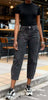 High-waist cropped barrel-leg jeans, black denim with button closure and belt loops