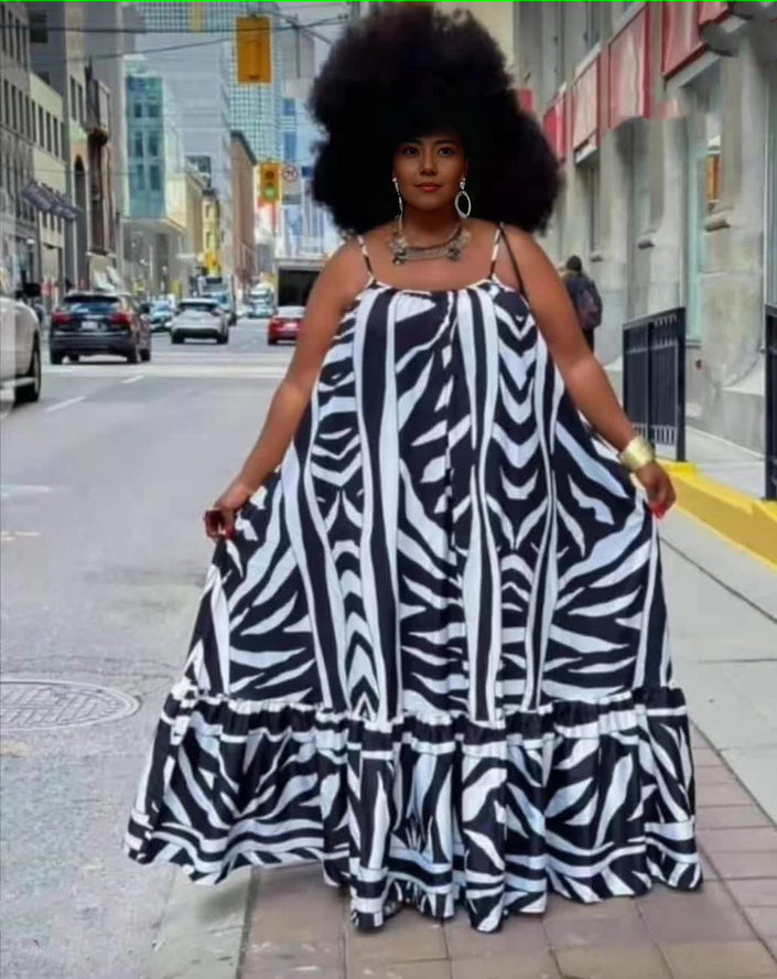 Plus size maxi dress with black-and-white animal stripe print, ruffle trim, spaghetti straps