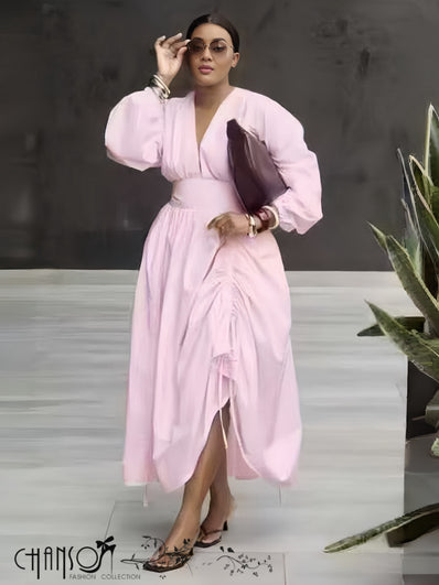 Pink midi dress with puff sleeves and ruched stretch waist, V-neck front slit