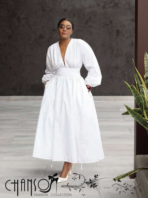 White midi dress with puff sleeves and cinched stretch waist, V-neck and full skirt