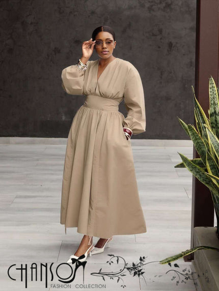 Khaki maxi dress with deep V-neck, puff sleeves, and gathered stretch waist