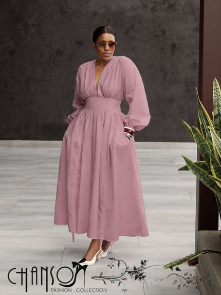 Pink maxi dress with deep V-neck, puff sleeves, and gathered stretch waist