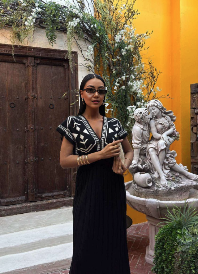 Black knit maxi dress with white geometric V yoke and short sleeves