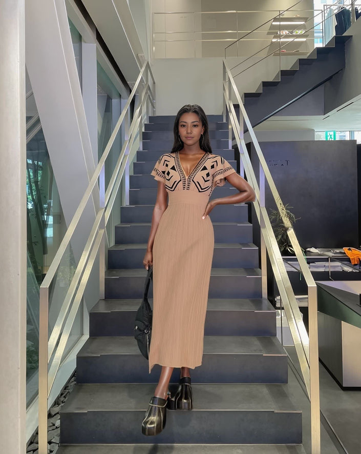 Tan knit midi dress with brown geometric V yoke and short sleeves