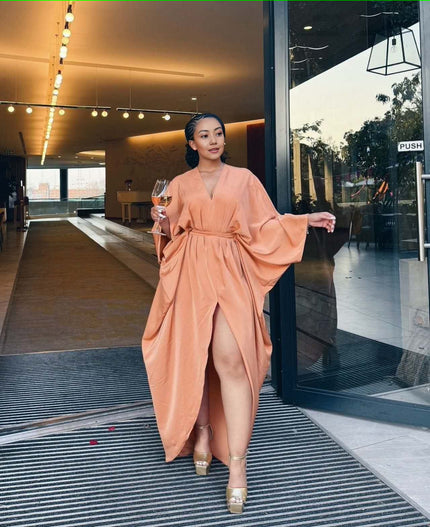 Peach loose-fit maxi dress, V-neck, long sleeves, split hem