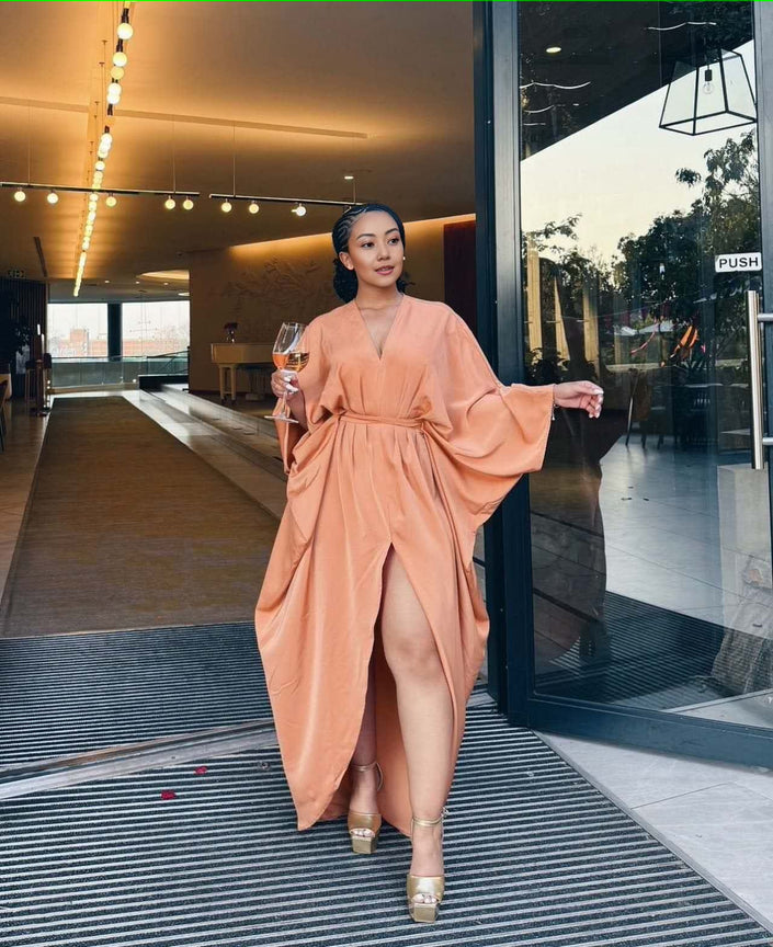 Peach loose-fit maxi dress, V-neck, long sleeves, split hem