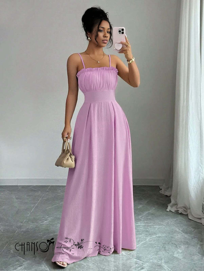 Pink pleated maxi dress with thin straps, ruched bust, and lace-trimmed hem