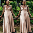 Peach maxi dress with tie shoulder straps and deep V-neck, adjustable fit