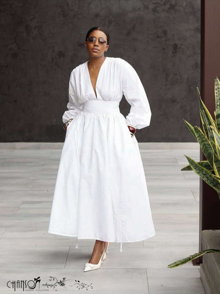 White deep V puff-sleeve formal dress with gathered waist and long full skirt