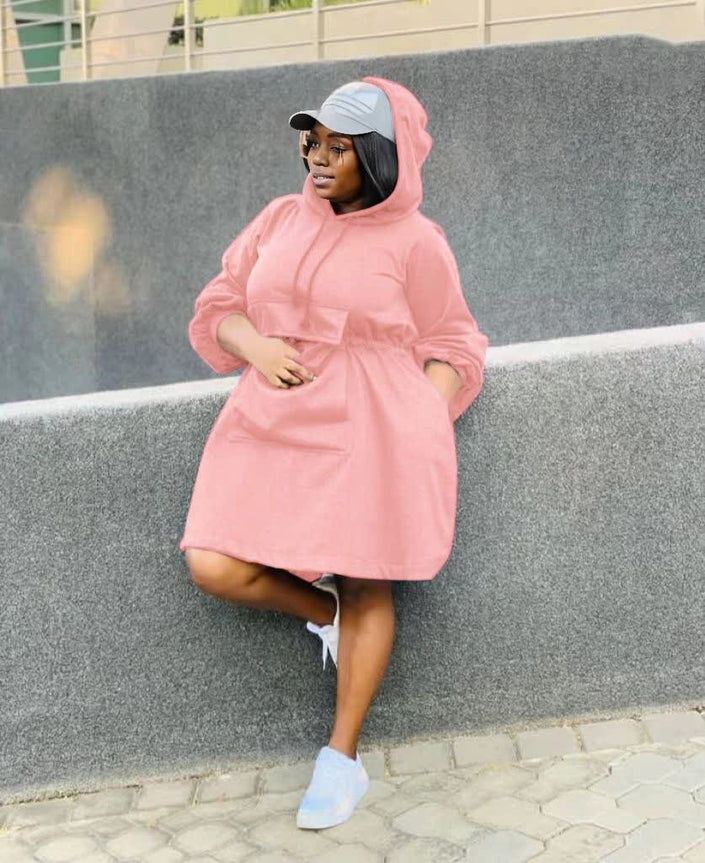 Pink oversized hoodie dress with front pocket and long sleeves