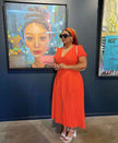 Orange-red button-down short-sleeve midi dress with V-neck and button front
