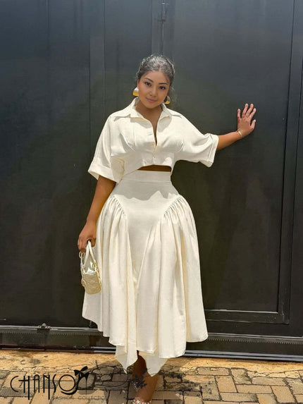 Cream midi dress with cropped short-sleeve blouse and pleated gathered asymmetric skirt