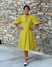 Lime green puff-sleeve midi dress with flared skirt and button front