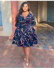 Plus size midi dress with navy abstract print, V-neck, waist tie, ruffle hem