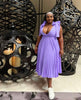 Women's Pleated Midi Dress with Deep V-Neck and Bow Shoulder Design