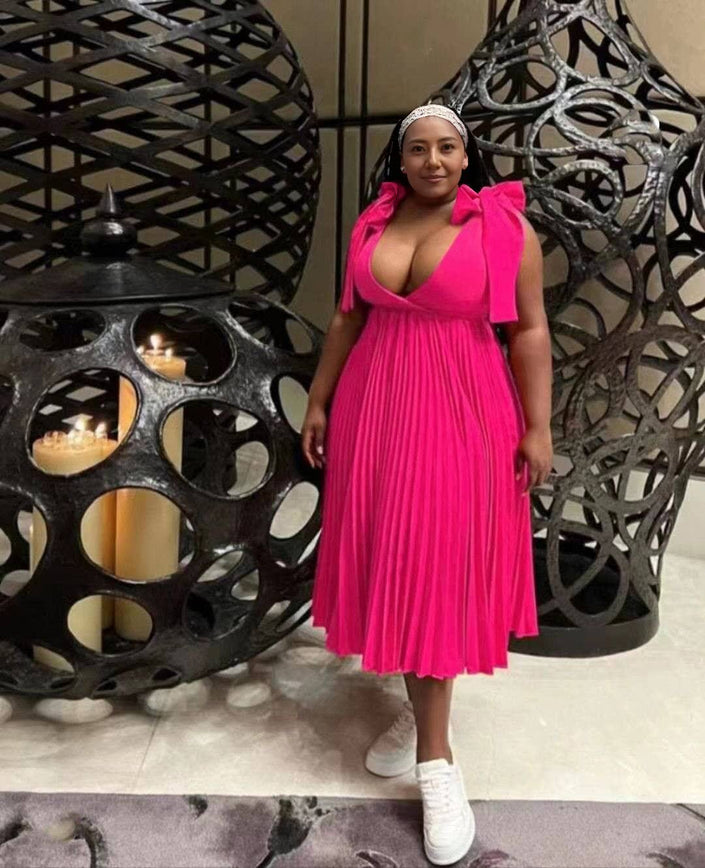 Hot pink pleated midi dress with V-neckline and gathered bodice, sleeveless