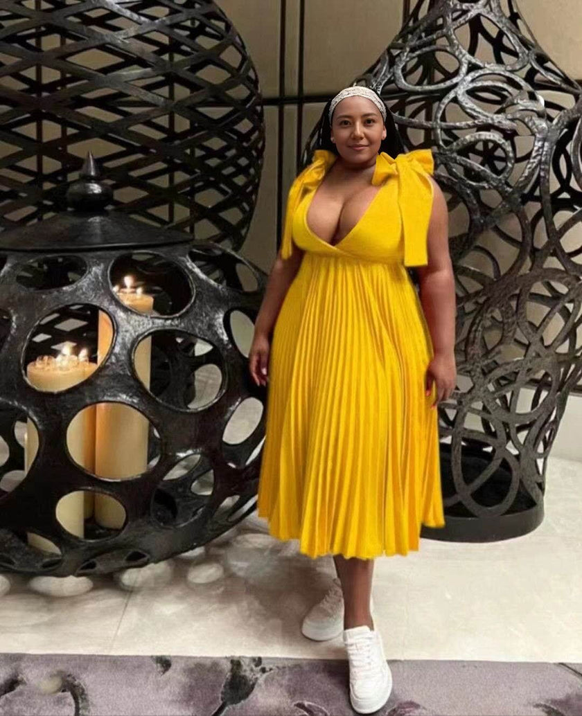 Yellow pleated midi dress with V-neckline and gathered bodice, sleeveless