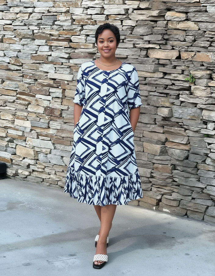 Plus size midi dress with navy-and-white geometric print and ruffle hem