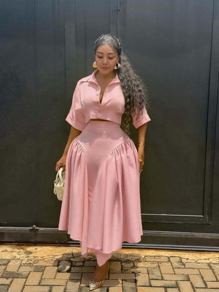 Pink midi dress with cropped button-up top and gathered asymmetrical skirt