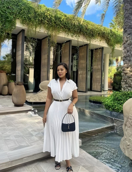White pleated midi dress with belted waist, V-neck and short sleeves.