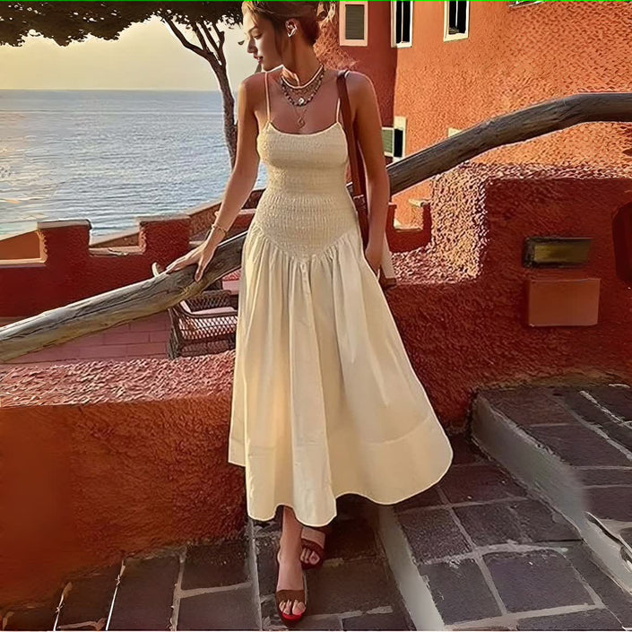 Cream smocked bodice sleeveless dress with flared midi skirt