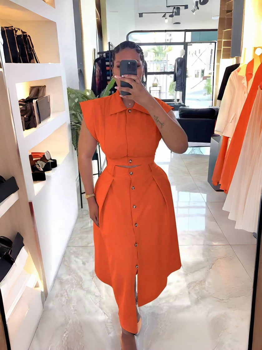 Orange-red midi shirt dress with button front, belted waist, asymmetric hem