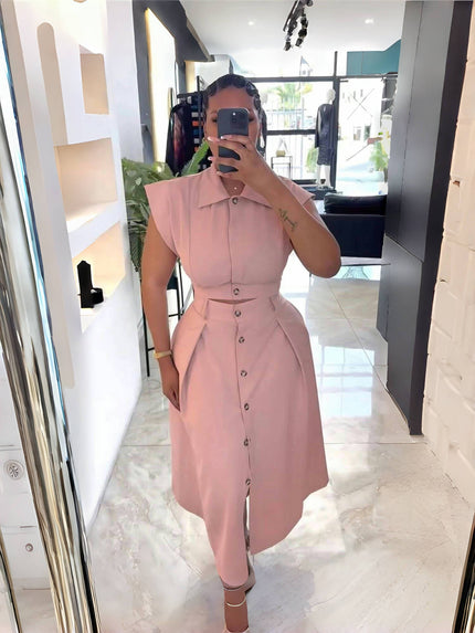 Light-pink midi shirt dress with button front, belted waist, asymmetric hem