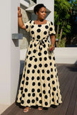 Tiered polka dot midi dress in white with black spots, short sleeves, belted waist