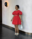 Red mini dress with puff sleeves and cut-out waist