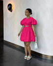Deep-pink mini dress with puff sleeves and cut-out waist