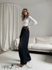 High-waist wide-leg jeans in black denim with pockets and belt loops