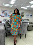 Plus-size geometric print dress with ruffle hem, short sleeves, multicolor teal and orange