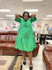 Bright green ruffle midi dress with tiered skirt, loose fit and gathered neckline